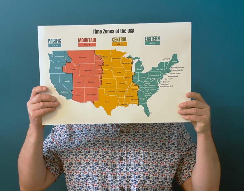 Person holding printed version of map